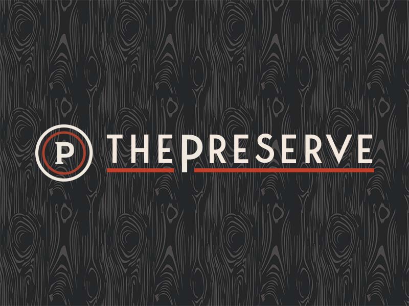 The Preserve uses a wood pattern as an accompanying brand element behind their logo