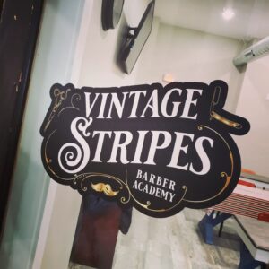 Vintage Stripes Barber Academy logo