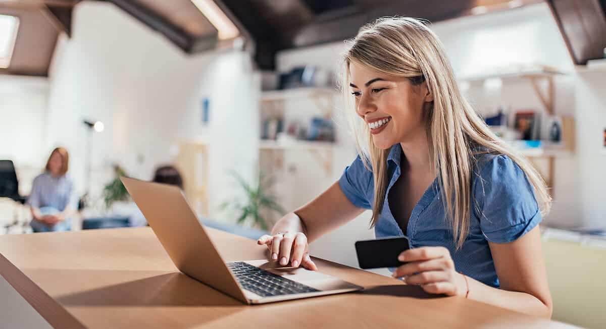 Woman shopping online on her laptop